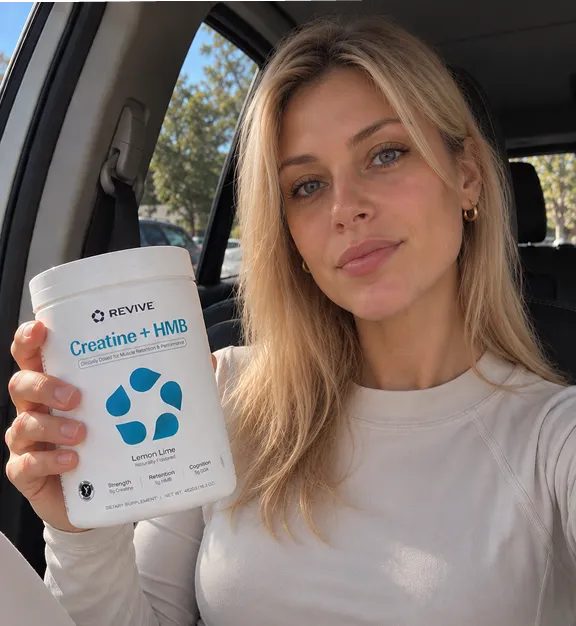 Customer holding a Revive product