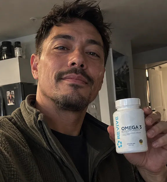 Customer holding a Revive product