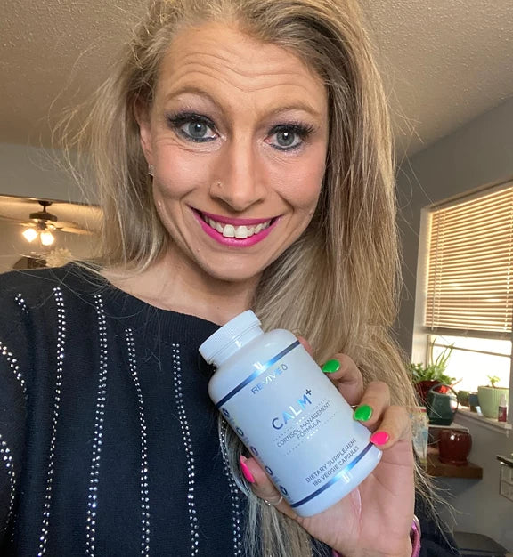 Customer holding a Revive product