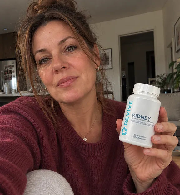 Customer holding a Revive product